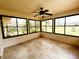 The sunroom boasts black framed windows that offer lots of natural light at 16905 Sw 30Th Avenue Rd, Ocala, FL 34473