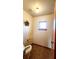 The toilet area features a window, wall decoration, and tile floor at 16905 Sw 30Th Avenue Rd, Ocala, FL 34473