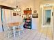 Cozy dining room with a round wooden table, four chairs, and decorative chandelier, perfect for Gathering meals at 10130 Sw 61St Terrace Rd, Ocala, FL 34476