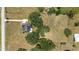 Aerial view of home on large lot with trees at 10600 Se 32Nd Ave, Ocala, FL 34480