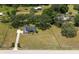 Aerial view of the home on a vast, grassy lot with mature trees, offering a peaceful and spacious setting at 10600 Se 32Nd Ave, Ocala, FL 34480