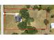 Aerial view of home on large lot with trees and defined by red boundary line at 10600 Se 32Nd Ave, Ocala, FL 34480