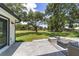 This home features a large backyard with a patio and firepit, perfect for entertaining at 10600 Se 32Nd Ave, Ocala, FL 34480