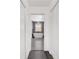 Hallway view leading to a primary bath with a freestanding tub at 10600 Se 32Nd Ave, Ocala, FL 34480