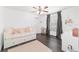 Cozy bedroom features wood-look floors and natural light at 10600 Se 32Nd Ave, Ocala, FL 34480