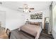 This bedroom offers a ceiling fan, and stylish decor at 10600 Se 32Nd Ave, Ocala, FL 34480