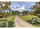 Long driveway leading to charming home with mature trees at 10600 Se 32Nd Ave, Ocala, FL 34480