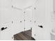 Hallway with multiple doors and dark wood floors at 10600 Se 32Nd Ave, Ocala, FL 34480