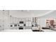 Modern kitchen with stainless steel appliances, bright white countertops, and stylish gray cabinetry at 10600 Se 32Nd Ave, Ocala, FL 34480