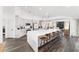 Open kitchen featuring a large island with seating, modern appliances, and updated cabinetry at 10600 Se 32Nd Ave, Ocala, FL 34480