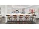 Spacious kitchen island with bar stool seating and modern design, perfect for entertaining and casual dining at 10600 Se 32Nd Ave, Ocala, FL 34480