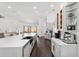 Bright, open-concept kitchen with stainless steel appliances, a large island, and sleek cabinetry at 10600 Se 32Nd Ave, Ocala, FL 34480