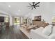 Stylish living room showcasing wood floors, modern furniture, and a scenic outdoor view at 10600 Se 32Nd Ave, Ocala, FL 34480