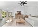 Bright living room with wood floors, modern furniture, and a decorative hutch at 10600 Se 32Nd Ave, Ocala, FL 34480