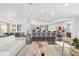 Open-concept living area seamlessly connects the living room, kitchen, and dining areas at 10600 Se 32Nd Ave, Ocala, FL 34480