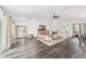 Spacious living room featuring wood floors, neutral decor, and lots of natural light at 10600 Se 32Nd Ave, Ocala, FL 34480