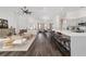 Open living space with a modern kitchen, dining area, and cozy living room, perfect for entertaining at 10600 Se 32Nd Ave, Ocala, FL 34480