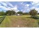 Home situated on vast, green acreage with wooden fence at 10600 Se 32Nd Ave, Ocala, FL 34480