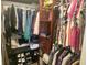 Walk in closet featuring organizers, hanging clothes, shelving and shoe storage at 10945 Sw 75Th Ave, Ocala, FL 34476