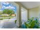 Inviting front porch with seating area, stone ground cover, and tasteful decor for relaxation at 12489 Se 90Th Ter, Summerfield, FL 34491