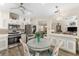 Bright kitchen features stainless appliances, stylish tile backsplash, and cozy eat-in area at 12489 Se 90Th Ter, Summerfield, FL 34491