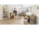 Bright living room boasting large windows, plush seating, and stylish decor perfect for relaxation at 12489 Se 90Th Ter, Summerfield, FL 34491