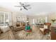 Spacious living area showcasing an open layout with comfortable seating and views of the dining area at 12489 Se 90Th Ter, Summerfield, FL 34491