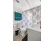 This bathroom has a toilet, sink, colorful shower curtain, and teal towel at 1330 Ne 55Th St, Ocala, FL 34479