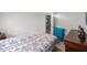 This bedroom features wood-look floors, a window, and dresser with decor at 1330 Ne 55Th St, Ocala, FL 34479