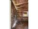 Garage interior with a rough wood finish, equipped with water hookups, and a small window at 1330 Ne 55Th St, Ocala, FL 34479
