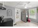 Kitchen with stainless steel fridge, white cabinetry and modern appliances at 1330 Ne 55Th St, Ocala, FL 34479