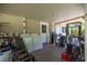 Patio with a laundry area featuring a washing machine, dryer, and outdoor storage at 1330 Ne 55Th St, Ocala, FL 34479