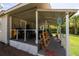 Open patio view featuring a collection of bicycles, outdoor equipment, and wood at 1330 Ne 55Th St, Ocala, FL 34479