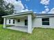 Backyard view of covered patio. Enjoy outdoor relaxing and entertaining in this covered space at 13305 Sw 114Th Pl, Dunnellon, FL 34432
