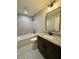Charming bathroom with granite counters, modern fixtures, tile flooring and shower-tub combo at 13305 Sw 114Th Pl, Dunnellon, FL 34432