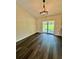 Open dining area featuring hardwood floors, vaulted ceiling, and sliding doors to the backyard at 13305 Sw 114Th Pl, Dunnellon, FL 34432