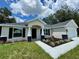 Charming single-story home with a welcoming front porch and well-maintained landscaping at 13305 Sw 114Th Pl, Dunnellon, FL 34432