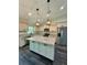 Modern kitchen featuring stainless steel appliances, granite countertops, and a large island at 13305 Sw 114Th Pl, Dunnellon, FL 34432