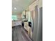 Modern kitchen with stainless steel appliances, dark accents, and granite countertops at 13305 Sw 114Th Pl, Dunnellon, FL 34432
