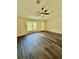 Spacious living room featuring stylish flooring and a large window providing natural light at 13305 Sw 114Th Pl, Dunnellon, FL 34432