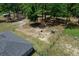 Large backyard area featuring mature trees and fenced perimeter, offering a secure outdoor space at 13479 Sw 100Th Ln, Dunnellon, FL 34432