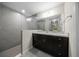 Contemporary bathroom with a glass-enclosed shower, dark cabinets, and modern fixtures at 13479 Sw 100Th Ln, Dunnellon, FL 34432