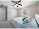 This bedroom offers a ceiling fan, window with blinds, and closet at 13479 Sw 100Th Ln, Dunnellon, FL 34432