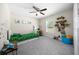 A brightly lit room with decorations, window, and grey carpet at 13479 Sw 100Th Ln, Dunnellon, FL 34432