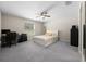 Cozy bedroom with neutral tones, a ceiling fan, and a comfortable bed and furniture at 13479 Sw 100Th Ln, Dunnellon, FL 34432
