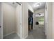 Hallway view leading to bedroom with a walk-in closet, featuring ample storage space and easy organization at 13479 Sw 100Th Ln, Dunnellon, FL 34432