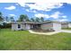 Charming single-story home with well-maintained lawn and attached garage at 13479 Sw 100Th Ln, Dunnellon, FL 34432