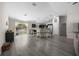 A spacious open-concept living room with a seamlessly blended modern kitchen with new stainless steel appliances at 13479 Sw 100Th Ln, Dunnellon, FL 34432