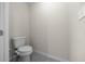 Compact powder room with a modern toilet and neutral color scheme, perfect for guests at 13479 Sw 100Th Ln, Dunnellon, FL 34432