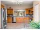 Bright kitchen boasting custom cabinetry, stainless steel appliances, and tile floors at 13835 Se 85Th Cir, Summerfield, FL 34491